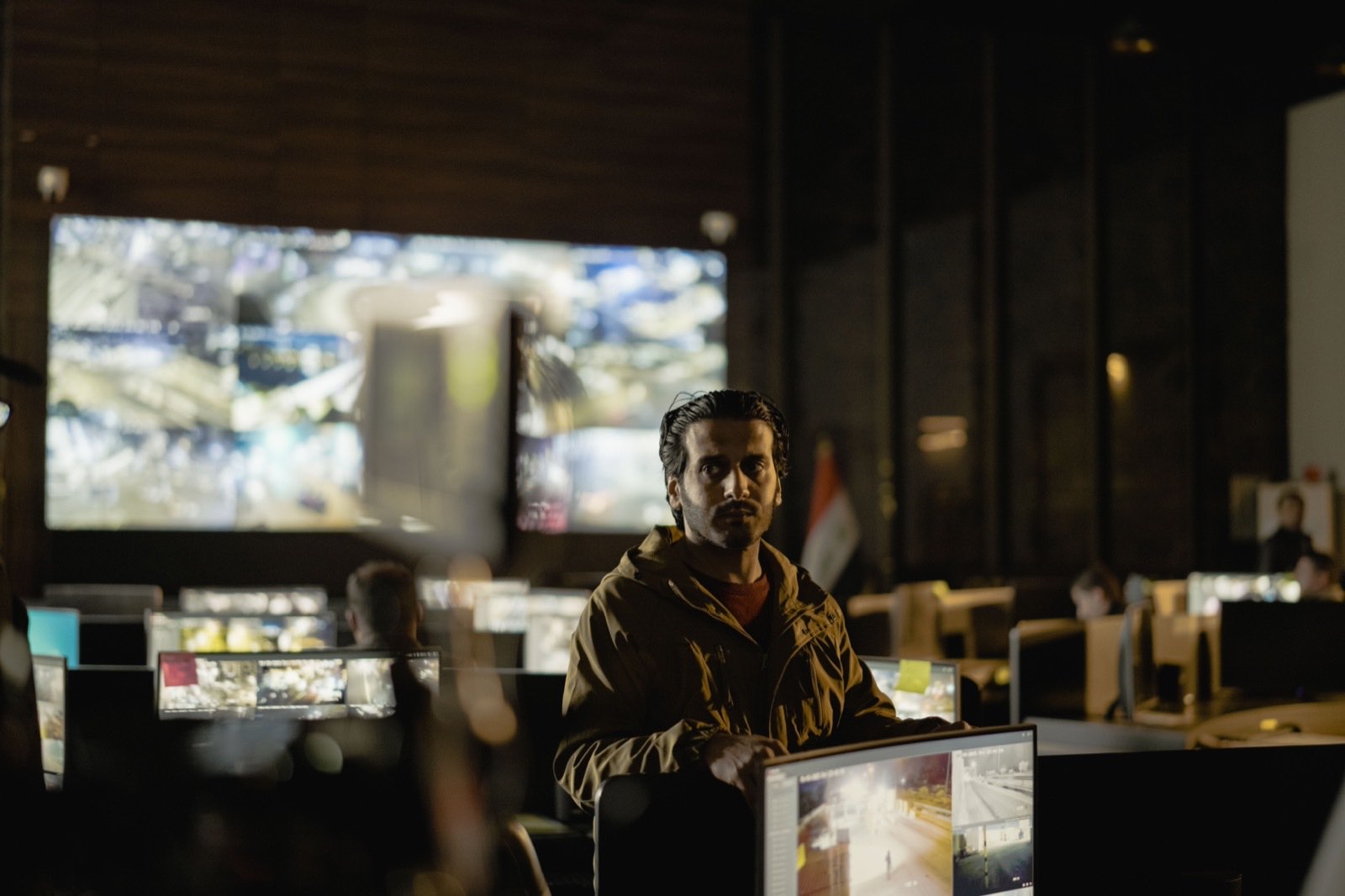 Security analysts monitoring live threat displays in an operations center